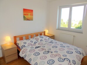 Apartamento, 2 quartos | 2 quartos, berços grátis, Wi-Fi de cortesia, roupa de cama