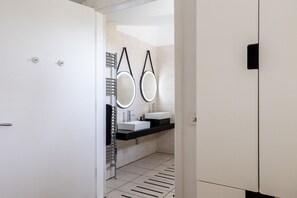 View into the en-suite wet room with his and hers washbasins, wheelchair-accessible holiday apartment with Llyn Maelog views in Llanfaelog, Anglesey