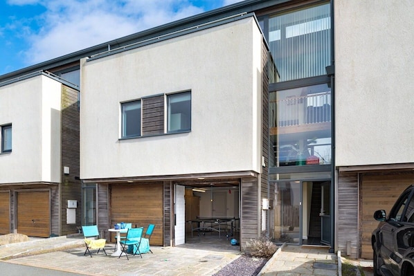 Exterior of The View, three-storey upside-down pet-friendly holiday home sleeping eight, two minutes from Crigyll Beach in Rhosneigr, Anglesey