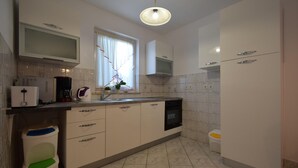 Apartment, 2 Bedrooms | Private kitchen | Coffee/tea maker, full-sized fridge, microwave, oven - Apartment Mira (Malinska-Dubasnica)