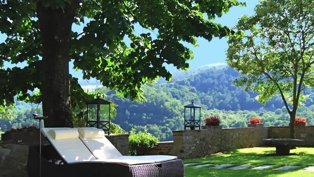 A sun lounger with a view of a mountainous landscape. - VILLA FIESOLANA - Twelve Bedroom Villa, Sleeps 34 (Pontassieve)