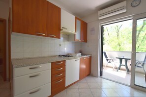 Apartment, 1 Bedroom | Private kitchen | Fridge, stovetop, coffee/tea maker, cookware/dishes/utensils - Apartment Srecko (Malinska-Dubasnica)