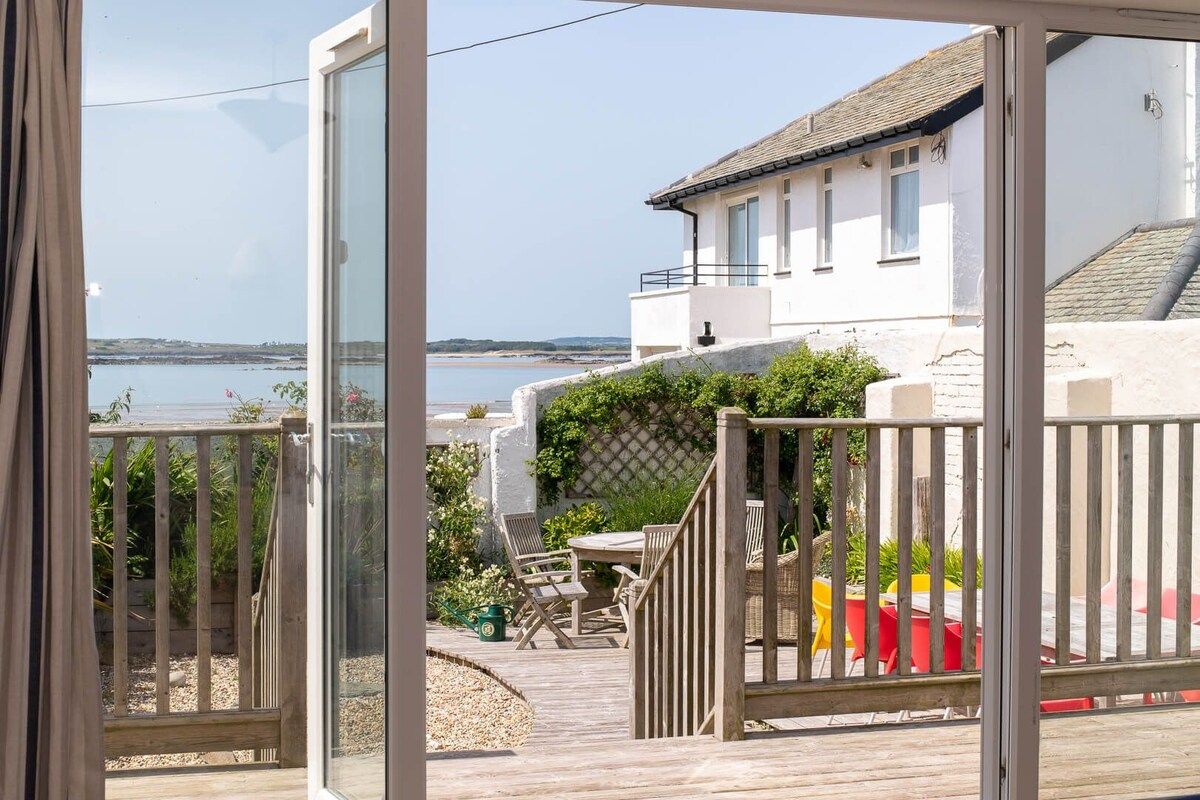 Sea views from the ground floor bedroom, five-bedroom holiday home 50 metres from the beach in Rhosneigr, Anglesey
