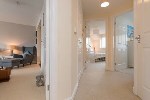 Spacious downstairs entrance hallway, ideal for sandy beach bags and wet gear, pet-friendly holiday apartment in Rhosneigr, Anglesey