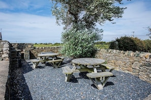 Outdoor seating area for al fresco relaxation, pet-friendly holiday cottage with countryside views in Aberffraw, Anglesey - Bwthyn Siwan: Two bedroom, pet-friendly holiday cottage (Ty Croes)