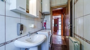 A bathroom with a sink, a washing machine, and a mirror. - Apartment Anka 2 with Balcony (Krk)