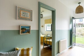 Bright entrance hallway, well-designed beachfront holiday cottage sleeping six with three bathrooms in Rhosneigr, Anglesey - Porth Crigyll: Beachfront holiday cottage on Anglesey (Rhosneigr)