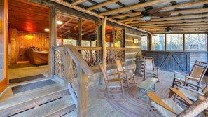 Screened-in porch with a view of the creek and mountains