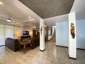 Relax in this stylish living area with a sofa, coffee table, and flat-screen TV.