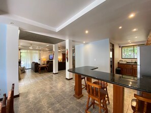 Enjoy meals in the well-equipped kitchen with a large island and dining area.