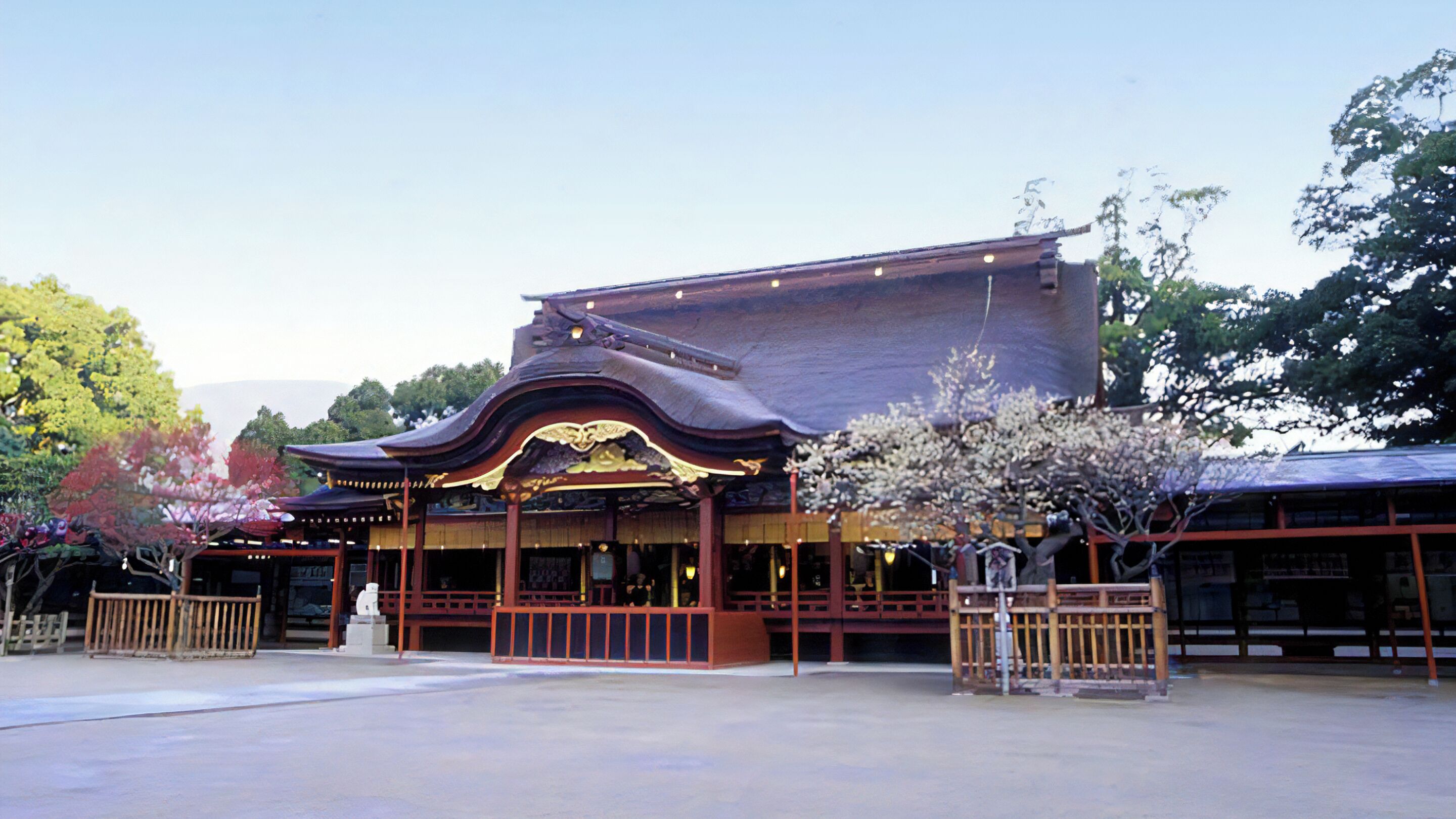 A traditional Japanese building with a curved roof and wooden railings.