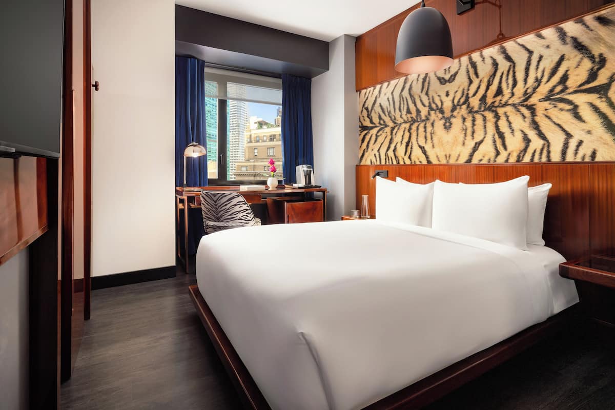 Deluxe Room, 1 Queen Bed | In-room safe, desk, soundproofing, iron/ironing board