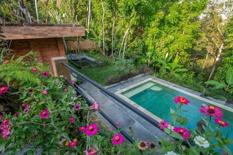 Deluxe Double Room | 1 bedroom, down comforters, pillowtop beds, individually decorated. Sanga Suites Villas