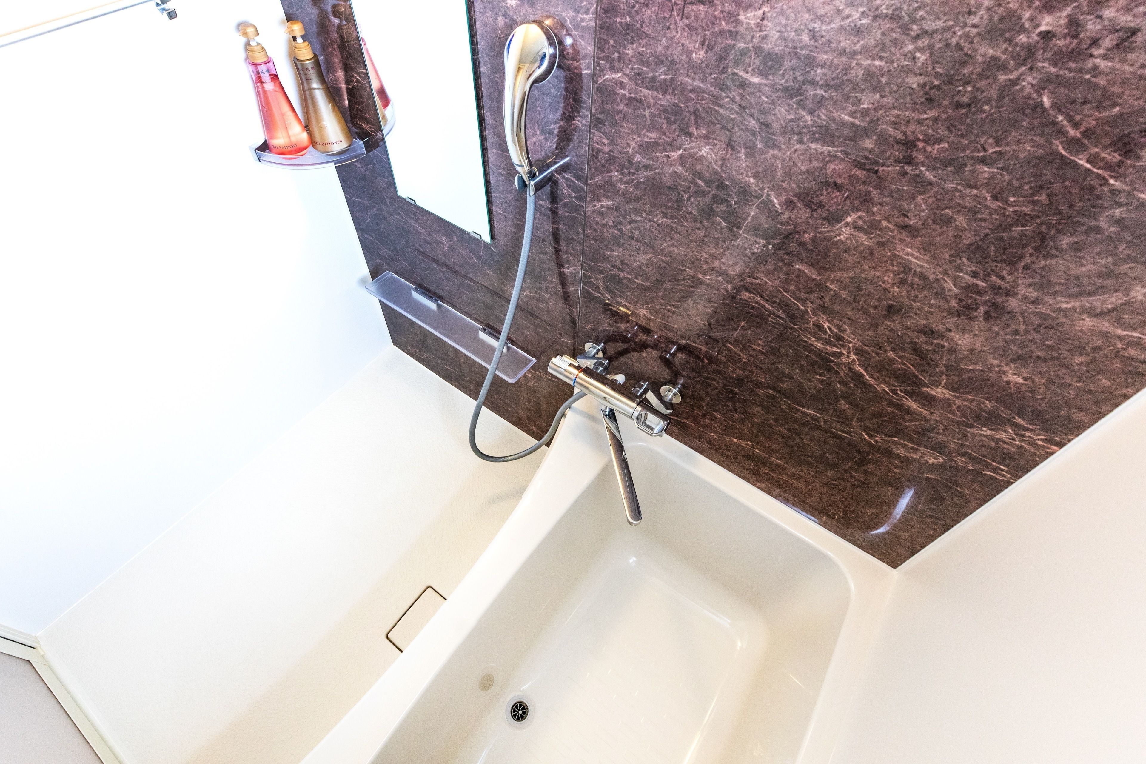 twin room | bathroom | separate bathtub and shower, deep-soaking bathtub, hair dryer, slippers