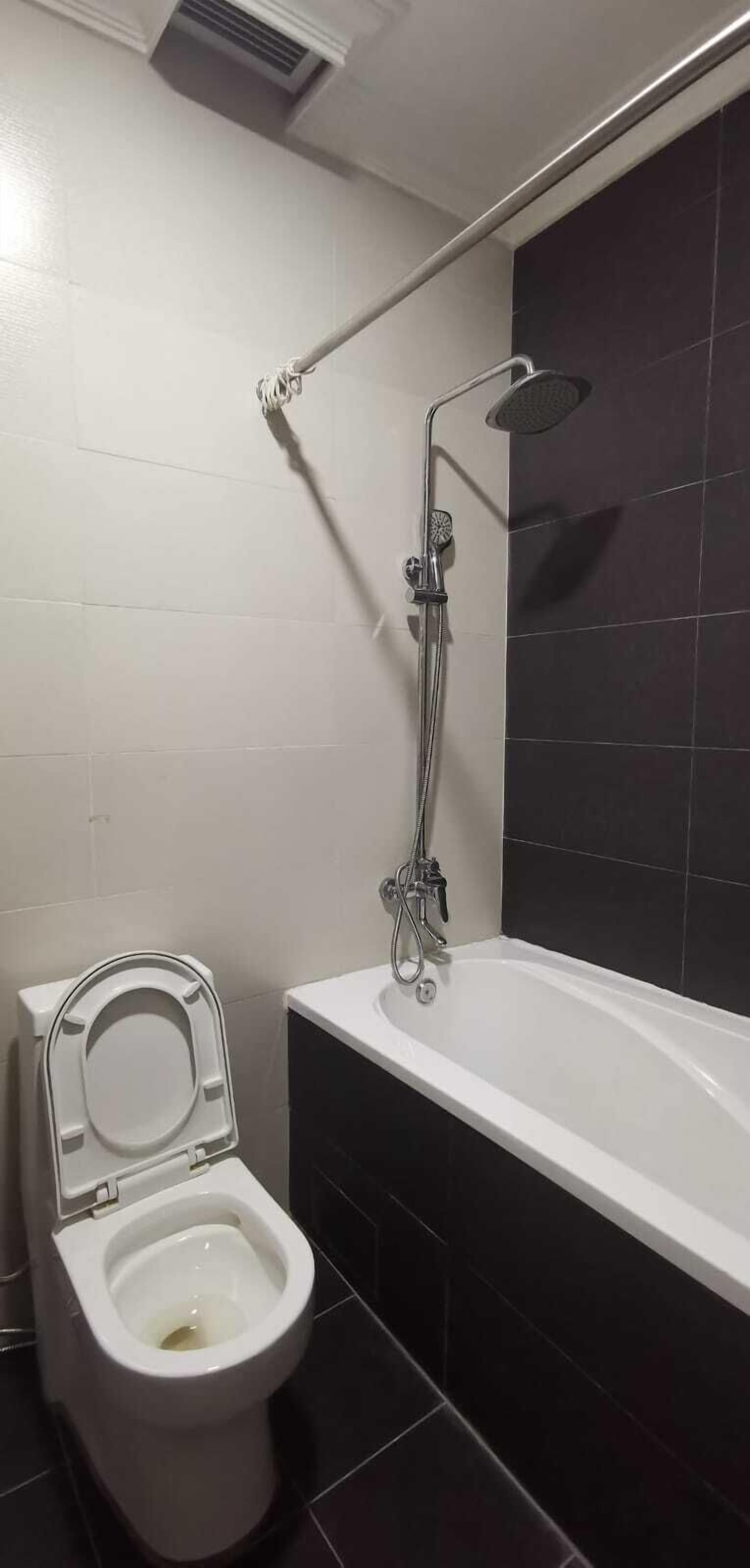 rajaudang room | bathroom | combined shower/bathtub, rainfall showerhead, slippers, bidet