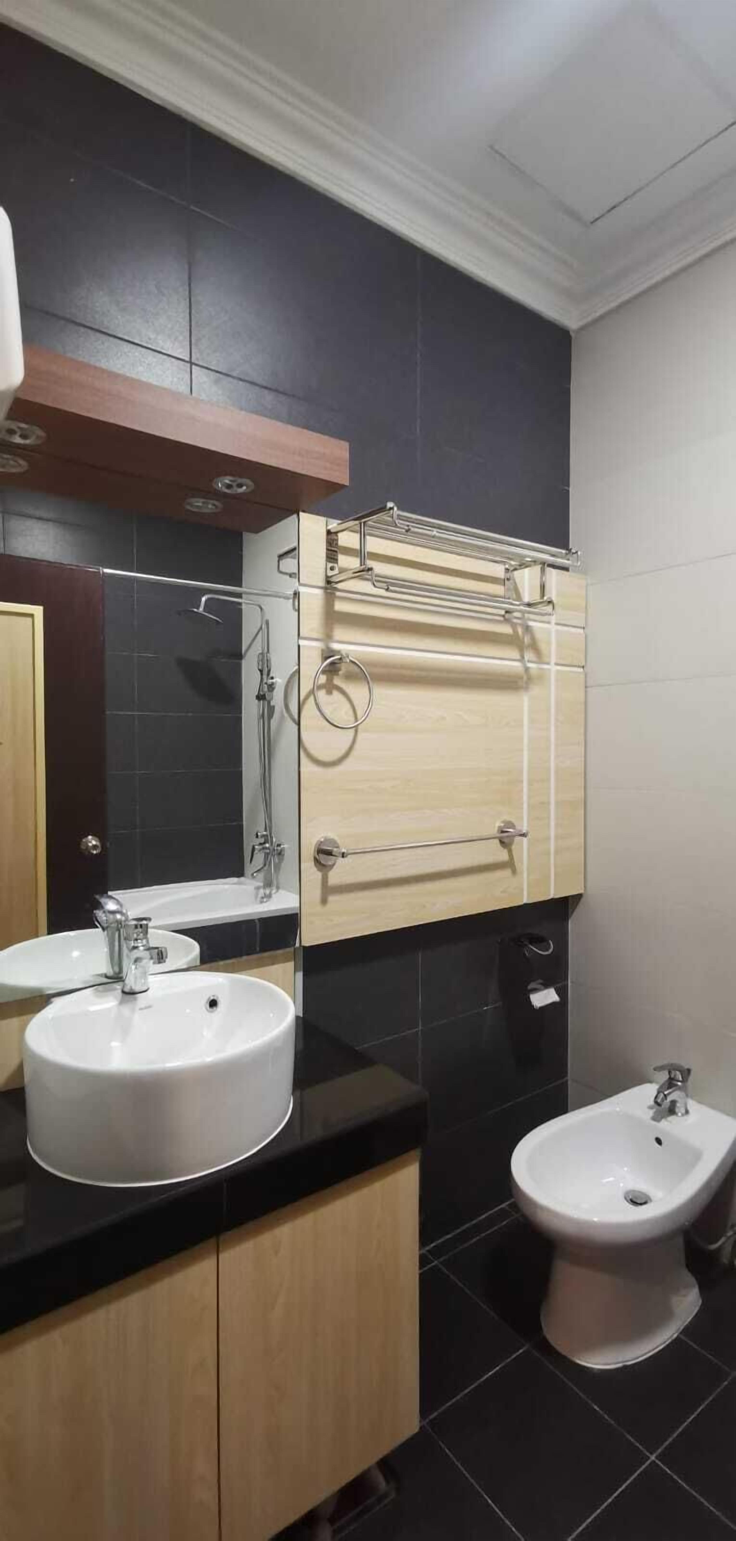 rajaudang room | bathroom | combined shower/bathtub, rainfall showerhead, slippers, bidet