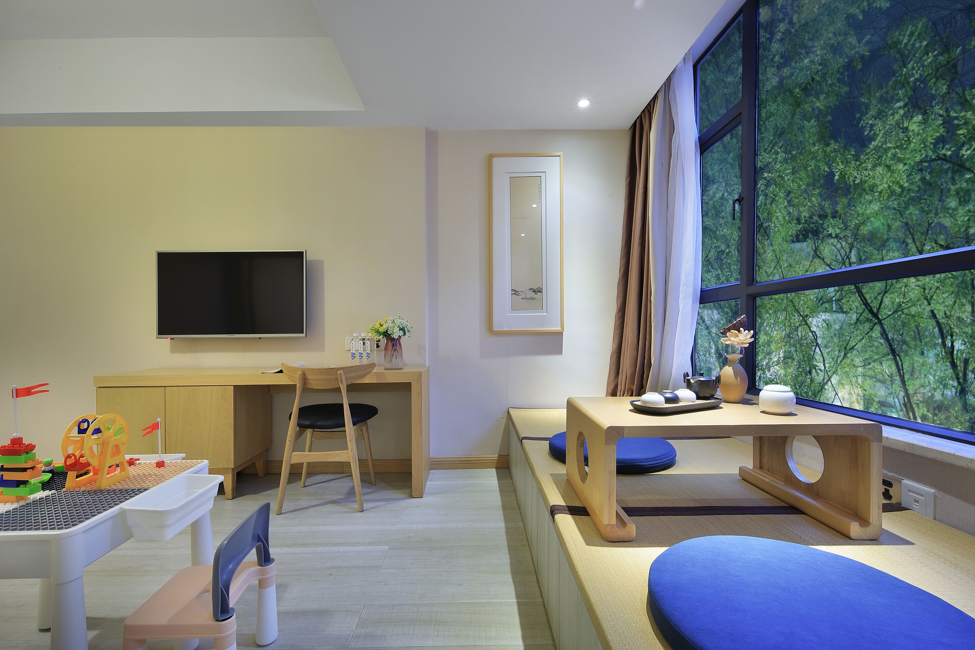 One-Bedroom Suite | Living area | 45-inch LED TV with cable channels, TV, toys