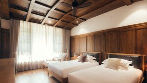 A room with two beds, wooden ceiling beams, and a large window with curtains. - Floral Hotel Wuxi Qietintfengyin Resort (Wuxi)