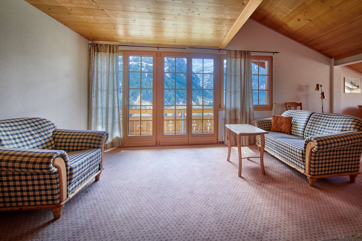 apartment, 2 bedrooms, balcony, mountain view | living area | flat-screen tv