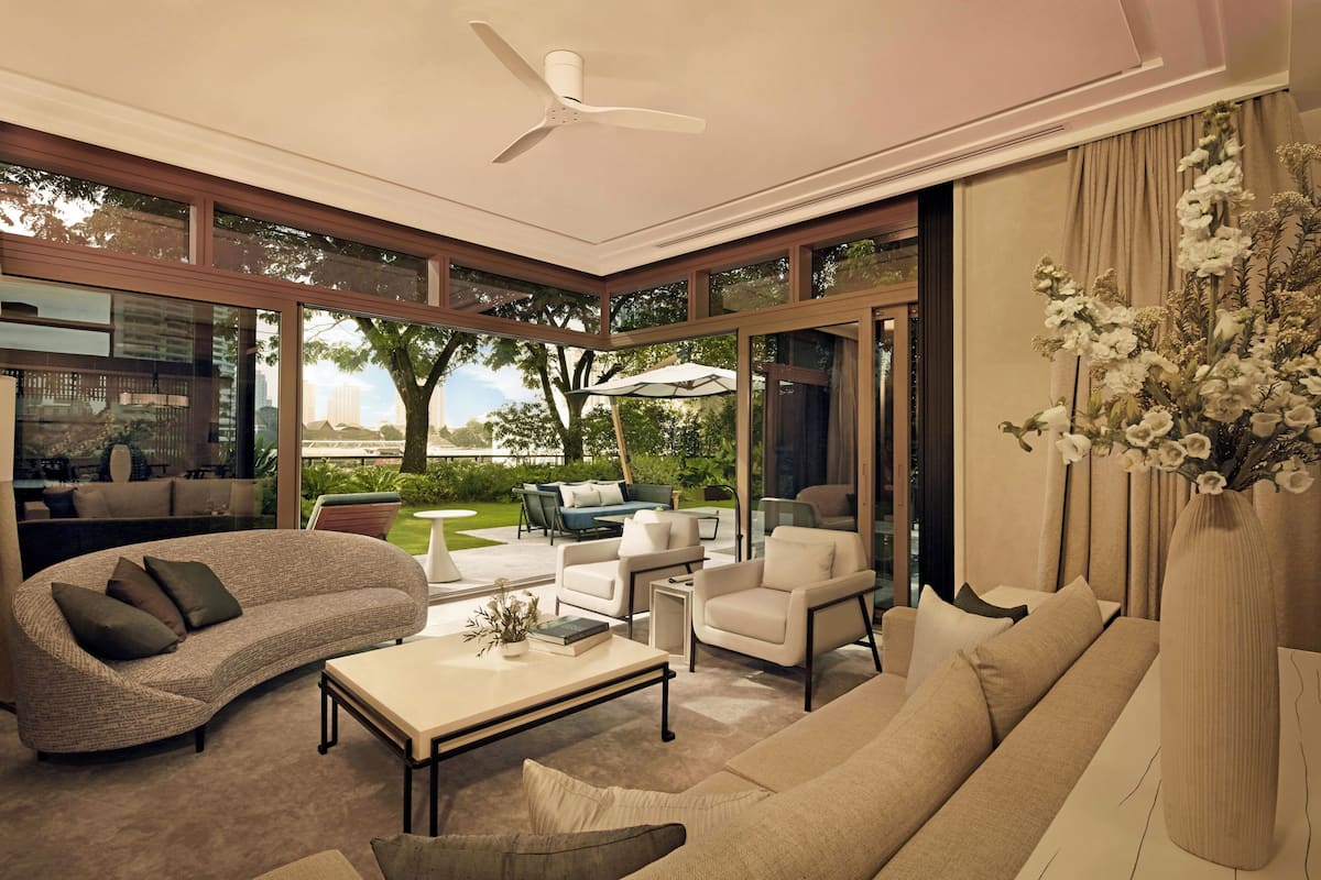 A modern living room with a large window, a ceiling fan, and a view of the outdoors.