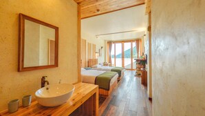 A wooden interior with a large sink, two beds, and a view of the outdoors. - Floral Hotel Qiandaohu Deyishe Inn (Hangzhou)