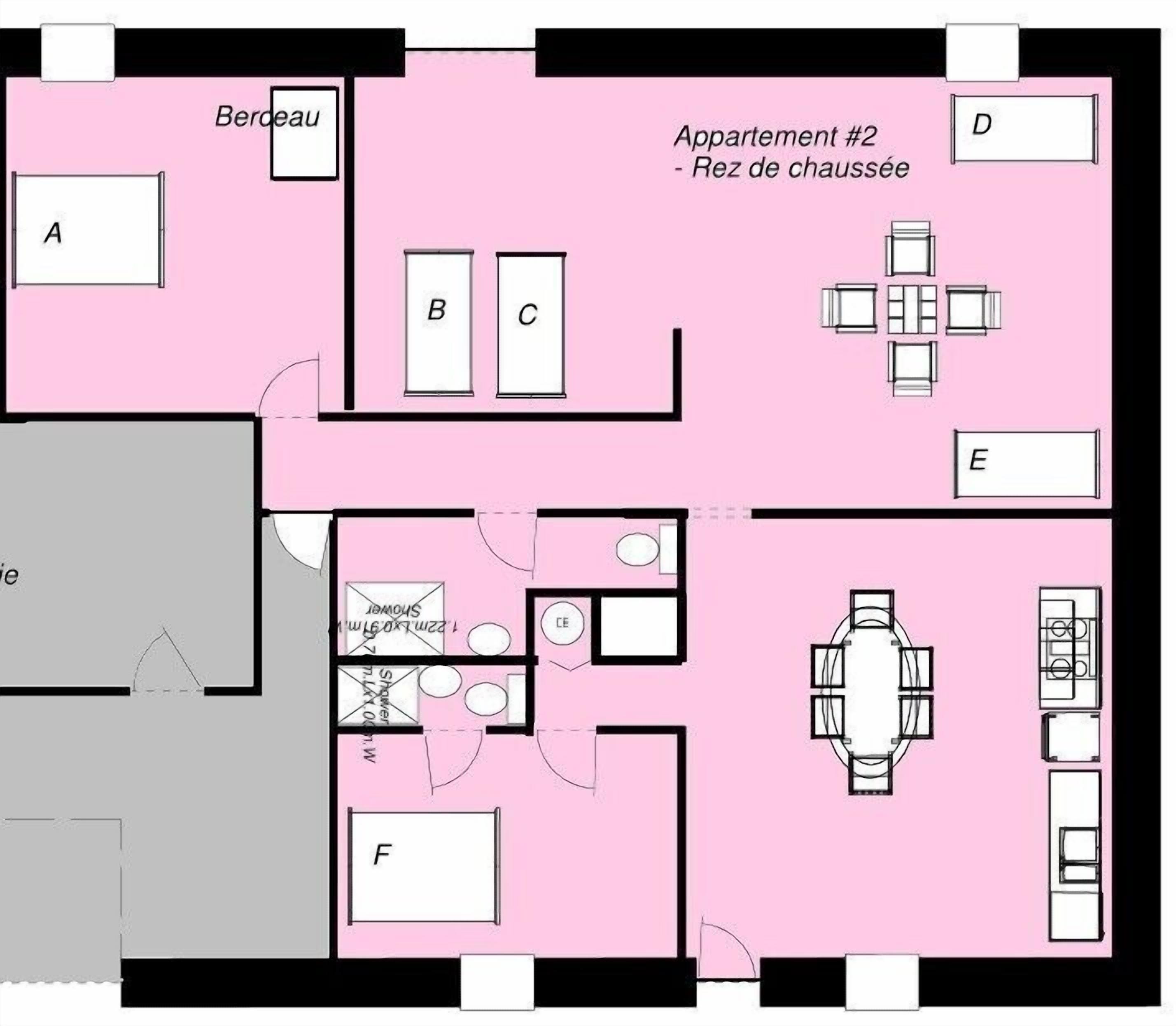 A hotel floor plan with a bedroom, bathroom, kitchenette, and dining area.