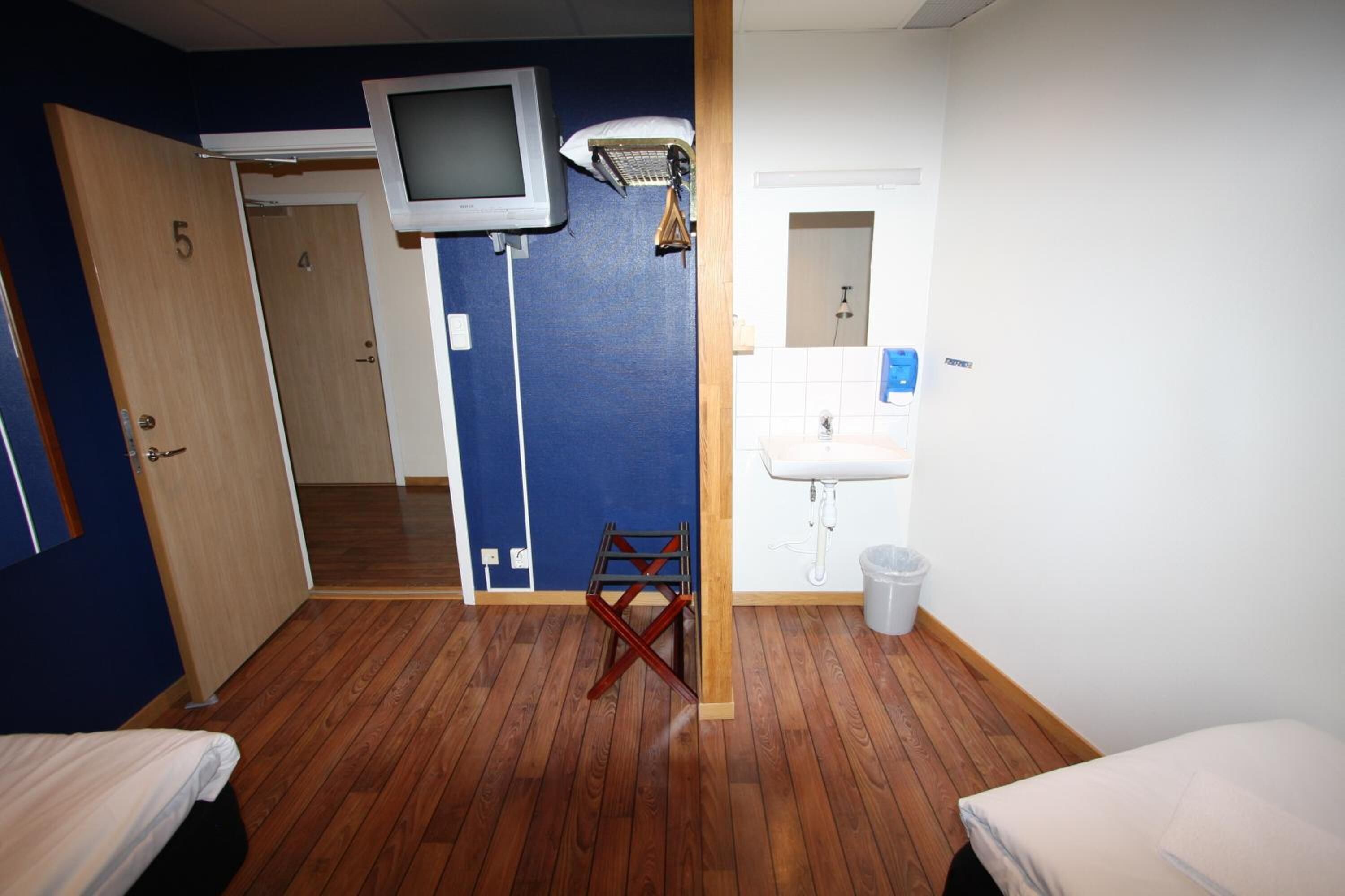 desk, laptop workspace, blackout curtains, iron/ironing board