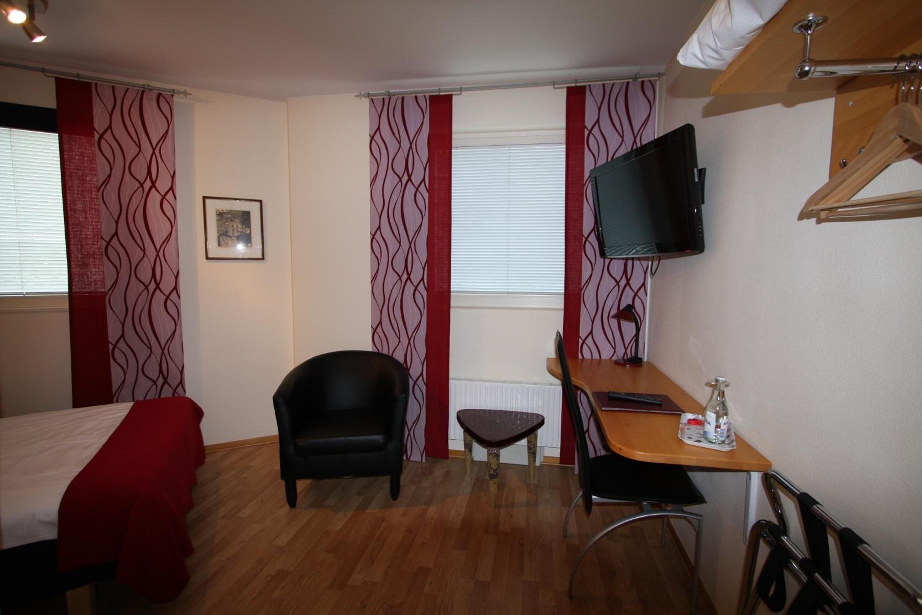 desk, laptop workspace, blackout curtains, iron/ironing board