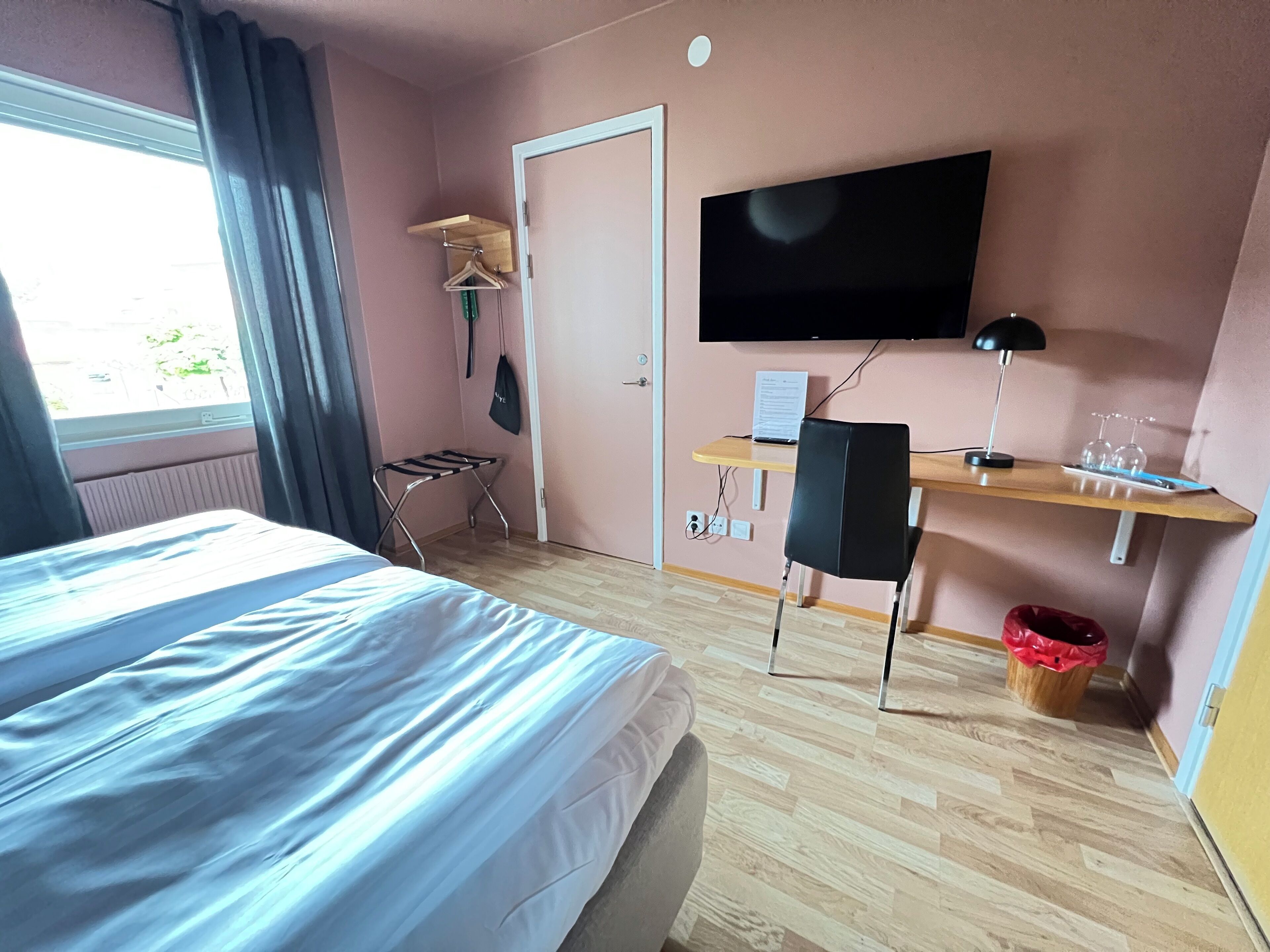 double room, courtyard view | desk, laptop workspace, blackout curtains, iron/ironing board