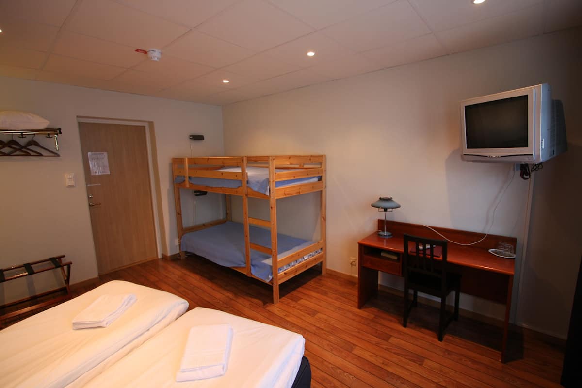 Quadruple Room (Shared Bathroom) | Desk, laptop workspace, blackout drapes, iron/ironing board