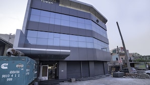 A modern building with a sign reading "KIRAN TOWER".