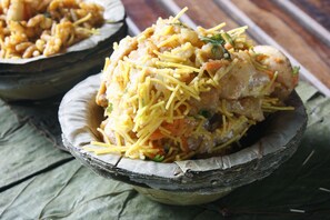 A dish of food served in a rustic, natural bowl. - OYO Townhouse 067 Chattarpur (New Delhi)