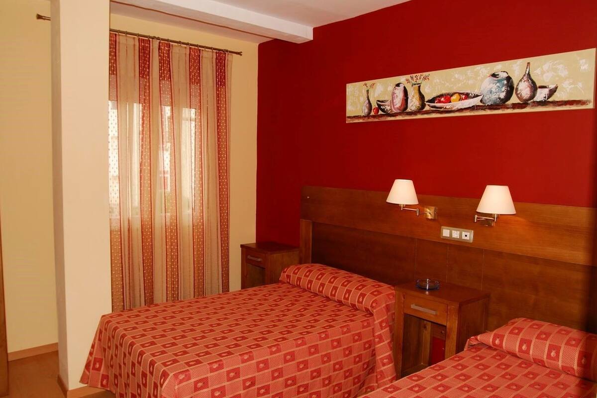 Desk, blackout curtains, free cots/infant beds, free WiFi