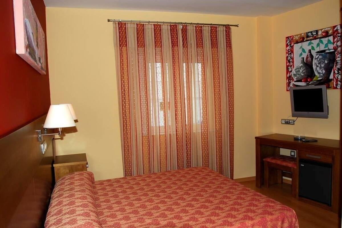 Desk, blackout curtains, free cots/infant beds, free WiFi