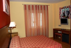 Desk, blackout curtains, free cots/infant beds, free WiFi