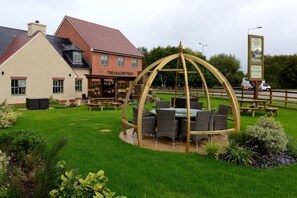 A pub named 'The Fallow Field' with outdoor seating and a wooden pergola structure. - Fallow Field, Telford by Marston's Inns (Telford)