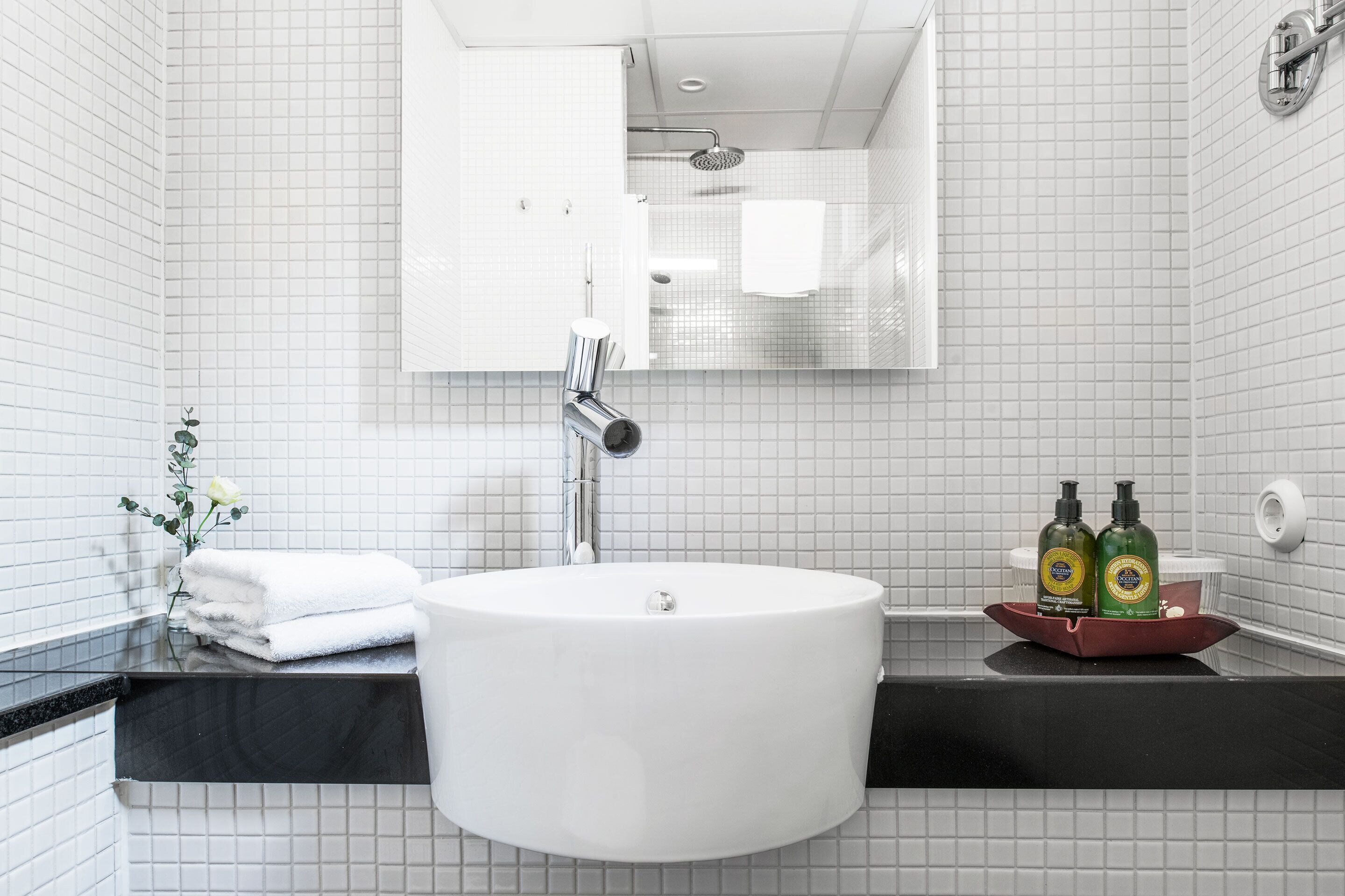 designer toiletries, hair dryer, bathrobes, slippers