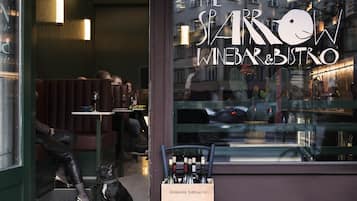 A restaurant with a sign reading "The Sparrow Wine Bar & Bistro".