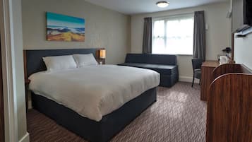 Family Room | Desk, laptop workspace, blackout curtains, iron/ironing board