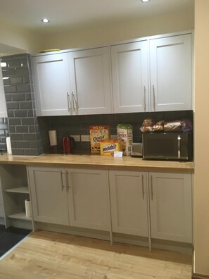 Full-size fridge, microwave, electric kettle