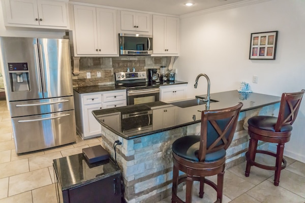 Remodeled kitchen and upgraded appliances including wine coolers