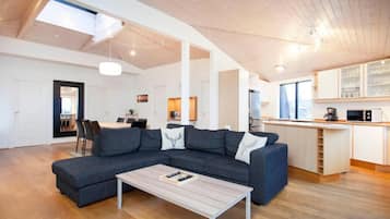 Penthouse, City View | Living area | 65-inch flat-screen TV with cable channels