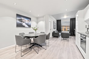 Comfort Apartment, 2 Bedrooms, Private Bathroom, City View | Living room | 65-inch flat-screen TV with cable channels