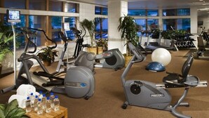 A hotel fitness center with treadmills, stationary bikes, and exercise balls. - Pines Townhome (Avon)