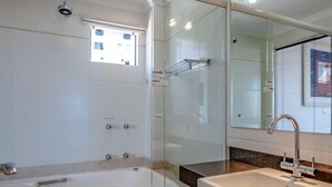 A modern bathroom with a glass-enclosed shower, a standalone bathtub, and a white sink. - VERY TOP! Beautiful APARTMENT Ocean Front HIGH STANDARD (Meia Praia)
