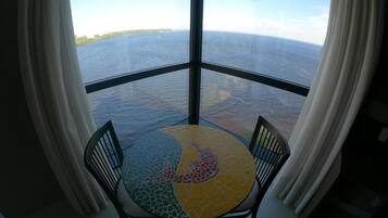 Deluxe Room | Living area | 49-inch LCD TV with cable channels, TV