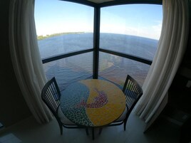 Deluxe Room | Living area | 49-inch LCD TV with cable channels, TV