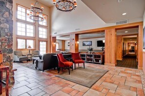 Relax in a spacious interior with multiple seating areas, a dining space, and a bar.