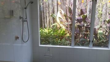 Bathtub, towels, soap, toilet paper