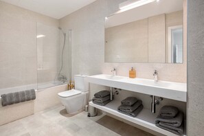 Bathtub, hair dryer, towels, soap